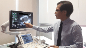 Prof Fong performing an ultrasound scan